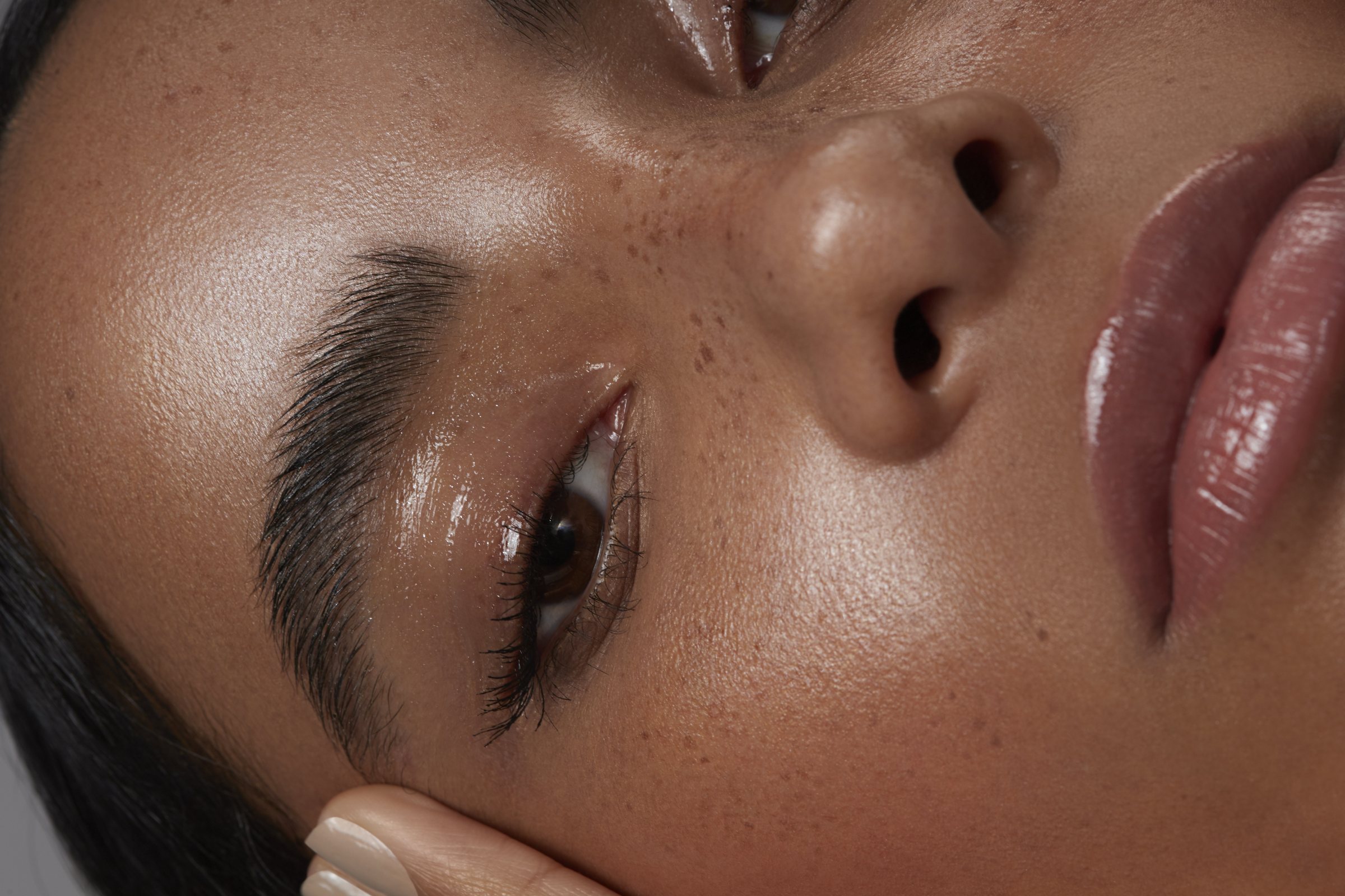 Close-up beauty detail — skin, brow and eye work